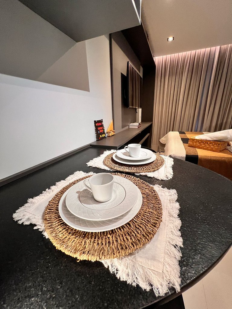 Flat pé na areia: acorde de frente pro mar