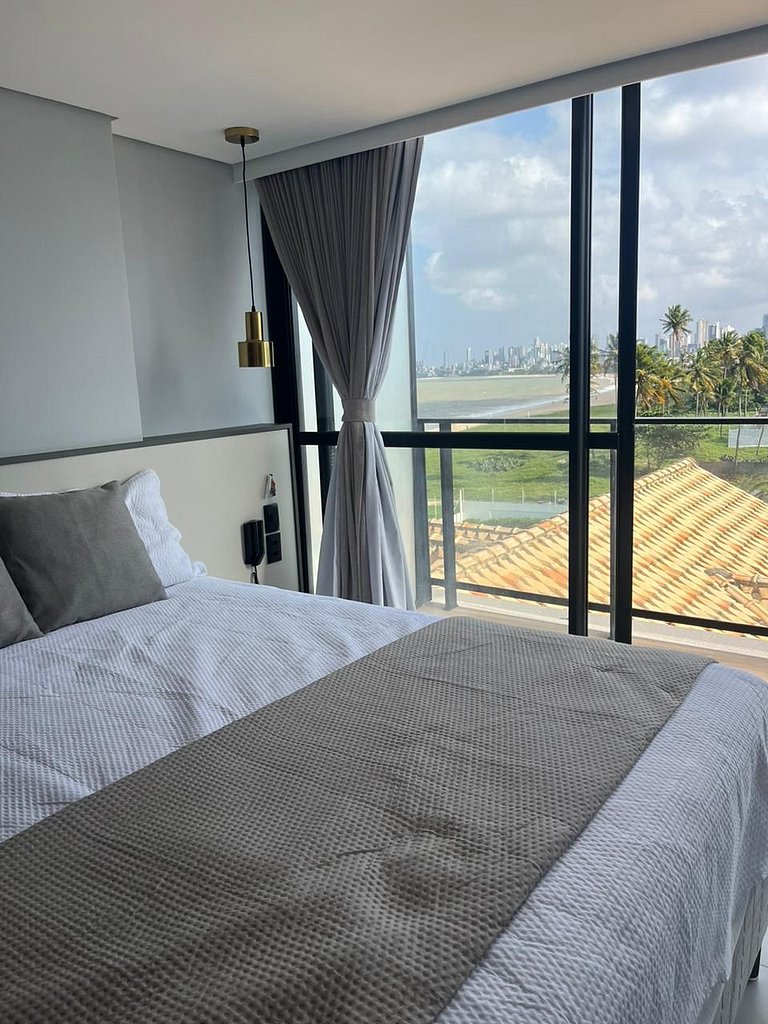 Seu refúgio premium à beira-mar com varanda