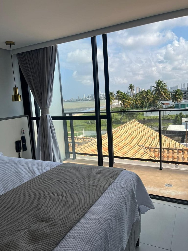 Seu refúgio premium à beira-mar com varanda